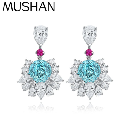 Pendientes de plata de ley 925 MUSHAN Custom Jewelry, diseño de corazón con rubí azul de laboratorio para mujer, baño de oro de 18 quilates, ideal para aniversario.