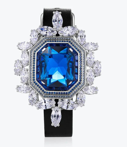Anillo de compromiso para mujer de la marca MuShan, elaborado en plata de ley 925 con zafiro creado en laboratorio, corte princesa y chapado en oro de 18 quilates, incluye set de limpieza.