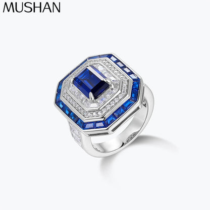 Anillo de compromiso para mujer de la marca MuShan, elaborado en plata de ley 925 con zafiro creado en laboratorio, corte princesa y chapado en oro de 18 quilates, incluye set de limpieza.