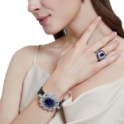 Anillo de compromiso para mujer de la marca MuShan, elaborado en plata de ley 925 con zafiro creado en laboratorio, corte princesa y chapado en oro de 18 quilates, incluye set de limpieza.